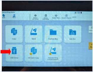Red arrow pointing to the USB Drive icon in the lower left of the screen